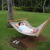 Veronica lounges on a hammock in front of the Outrigger Keauhou Bay